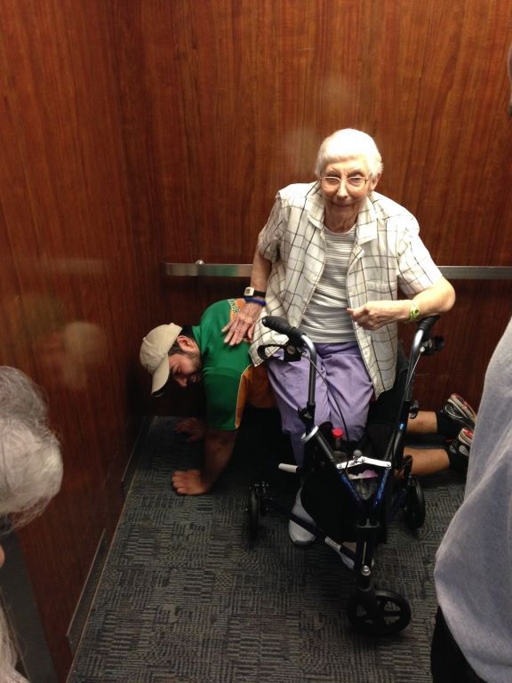 Man Lets Elderly Woman Trapped in Elevator Sit on Him - Neatorama