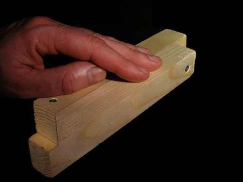 hand on wood illusion
