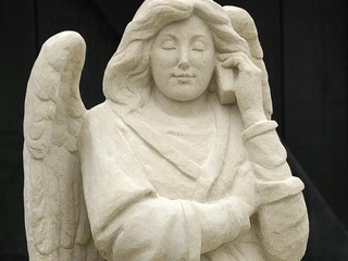 angel with mobile phone
